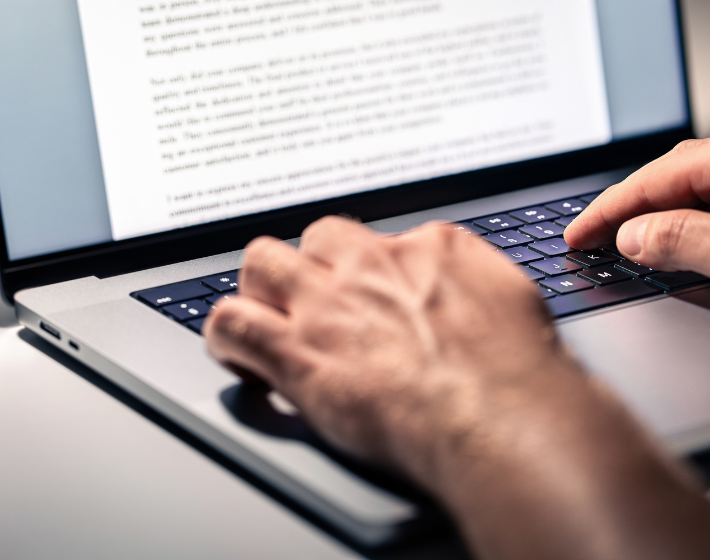Stock photo of person typing letter