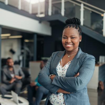 Woman in business suit crossing arms