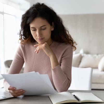 woman reading paper