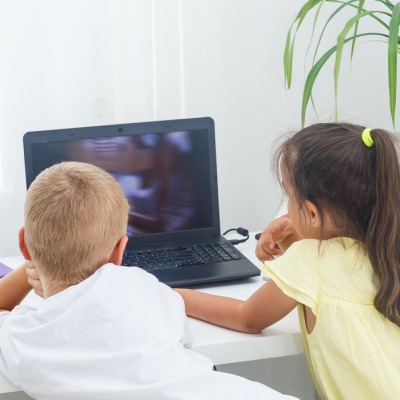 Boy and Girl looking at a computer screen