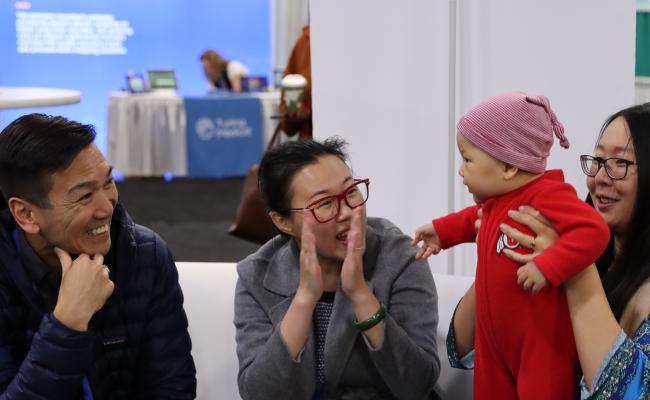 family clapping at baby